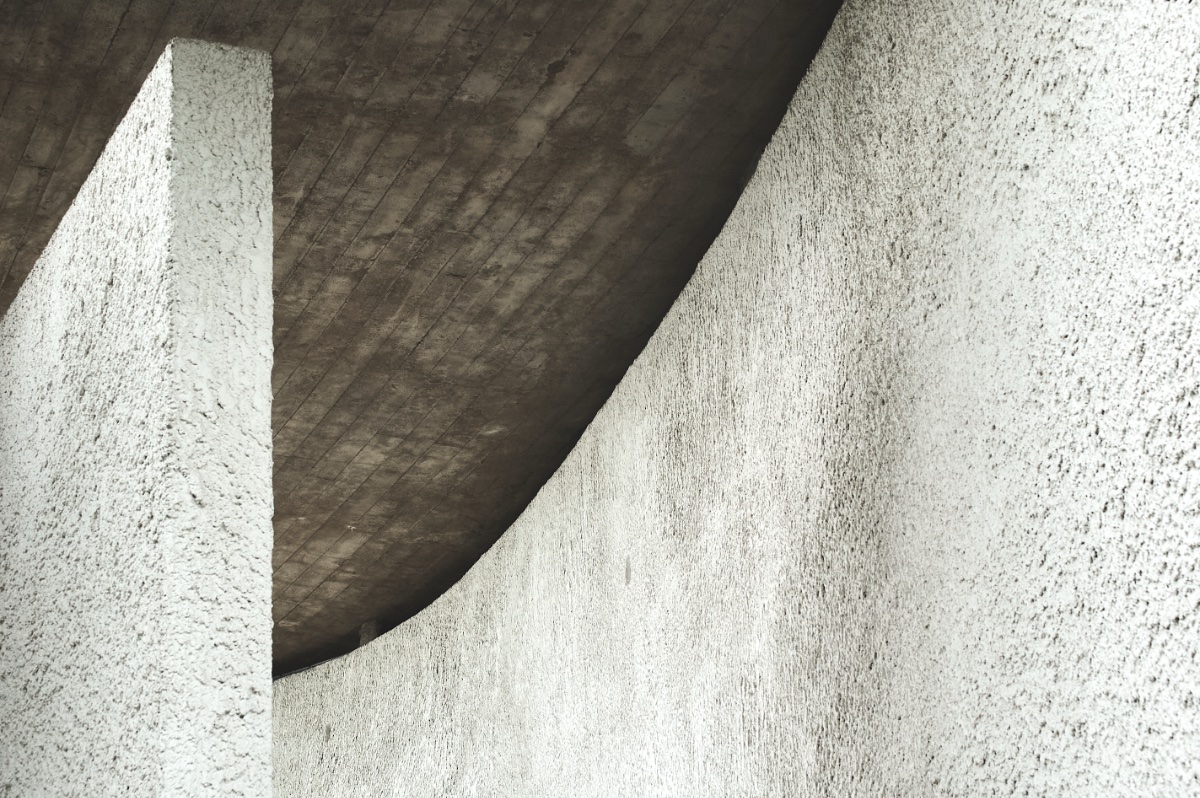 Converging verticals on the curved whitewashed walls.